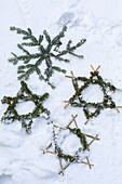 Stars made of conifer branches in the snow