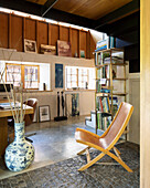 Folding chair in studio apartment in converted barn