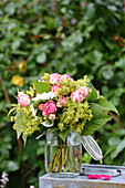 Summer bouquet of hydrangeas, lady's mantle and roses