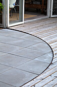 Decking of concrete slabs and wooden planks