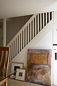 White painted wooden banister and artwork