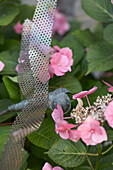 Metal ornaments with pink flowers