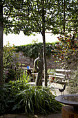 Courtyard garden with bird bath in Rye, Sussex