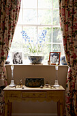 Dressing table and floral curtains at Arundel window, West Sussex