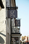 Whitewashed facade and shop signs in Rye, Sussex