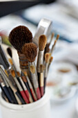 Paint brushes in artists studio in Arundel, West Sussex