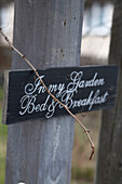 Welcome sign hangs on gate of Mariefred Bed and Breakfast Sweden