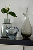 Glass decor with jasmine on shelf close-up