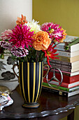 Cut flowers and books on tabletop