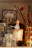 Christmas decorations and paintbrushes with glassware