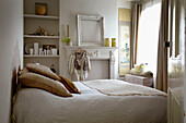 White and cream bedroom of London home