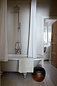 Freestanding roll-top bath in Brighton home, East Sussex, England, UK