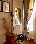 Hallway with carved wooden chair and ski boots