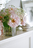 Arrangement of pink roses in glass vase