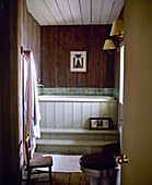 Bathtub with wood panelled front