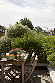 Wooden table and chairs on roof garden