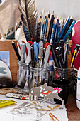 Pens and pencils on workbench in studio of printmaker