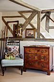 17th century timber framed interior with chest of drawers and chair Hampshire, UK