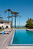 Beach house exterior with poolside decking