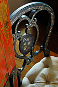 Ornate carved chair back