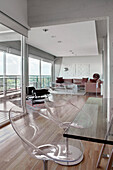 Open plan living room with 20th century Design and large windows with city views
