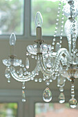 Glass chandelier with light bulbs