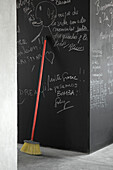 MDF kitchen store room painted black with phrases and chalk drawings