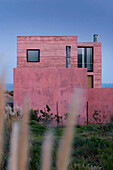 Pink coastal beach house exterior