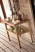 Side table with lanterns on decked veranda