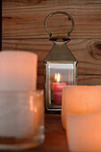 Lit candle in hurricane lamp