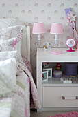 Bedside table with lamp and patchwork quilt