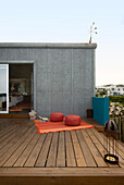 Rooftop terrace with Indian floor seating and a woven bedspread made in Salta Argentina