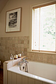 Neutral bathroom in modernised 17th Century Oxfordshire family home