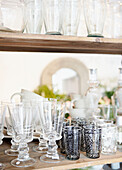 Selection of glassware on wooden shelf