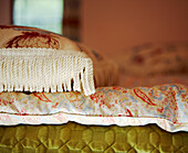 Embroidered pillow with fringing on quilt cover 