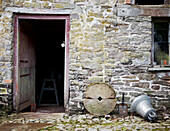 View through open door of stone barn exterior