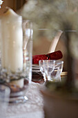 Red Christmas cracker and glassware on tabletop
