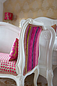 Velvet spot and stripe chenille fabrics are mixed together on the upholstered bed bench