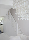 All white interior staircase and decorative light fitting
