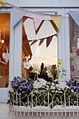Window box and bunting on house exterior