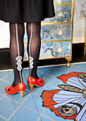 Low section ornate tights with butterfly motif painted flooring