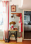 Spotted aprons and homeware on wooden side table of Edwardian terraced house in Gateshead