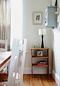 Painted chairs and wooden side table in Wairarapa home North Island New Zealand