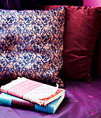 Hardbacked books and upholstered cushions
