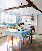1950s kitchen with beamed ceiling in pastel blues