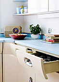 1950s kitchen with retro radio and open drawer
