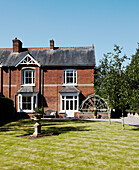 Brick exterior of British home and back garden