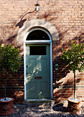 Front door in brick exterior of British home 