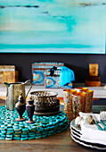 Moroccan glass and silverware with turquoise beaded tablemats