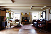 Sofas at fireside of wood burning stove